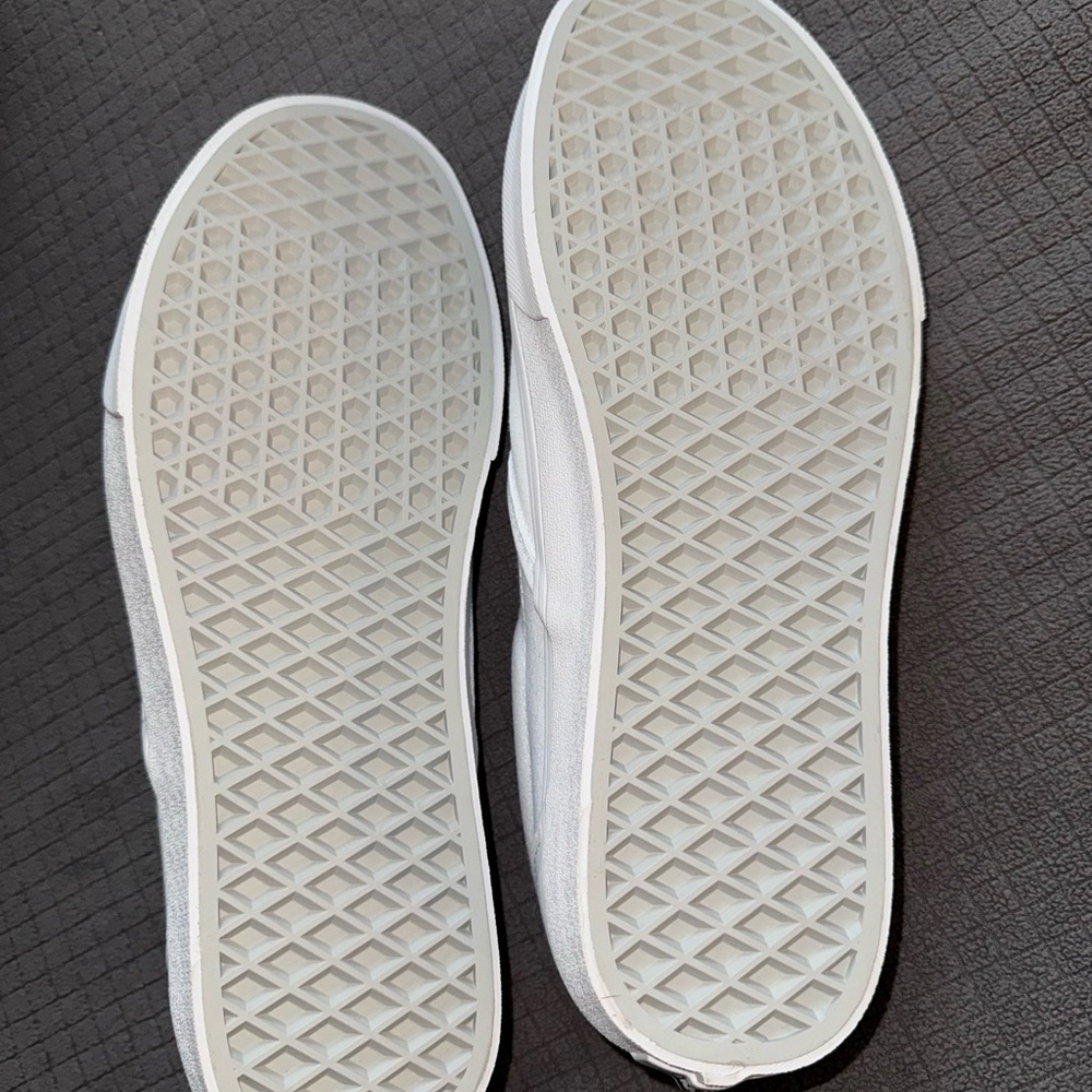 White slip on Vans. Size 11 women’s, 9.5 Men. BRAND NEW